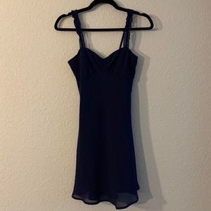 Urban Outfitters navy blue slip dress with
ruffled sleeves